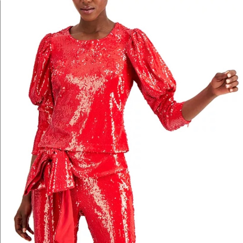 Red hot sequin top with puffed sleeves.